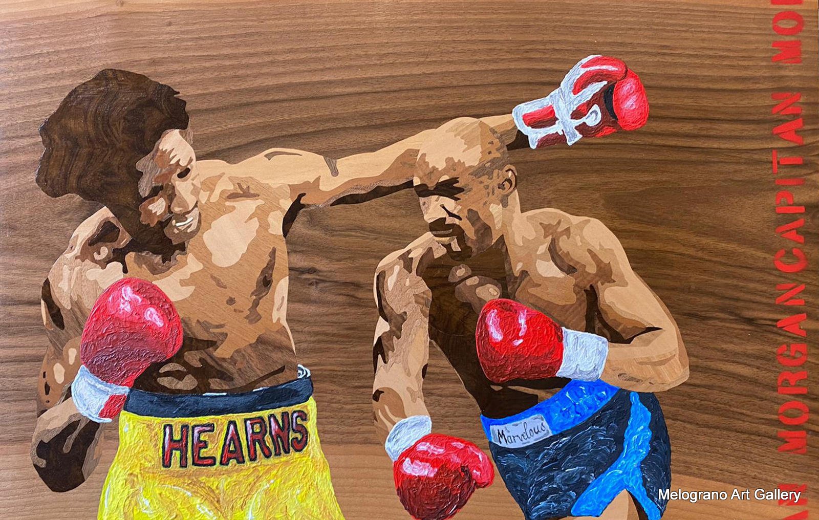 Intarsio ligneo di Capitan Morgan raffigurante il celebre incontro di boxe Hagler vs Hearns “The War”, realizzato con legni naturali e colori acrilici.