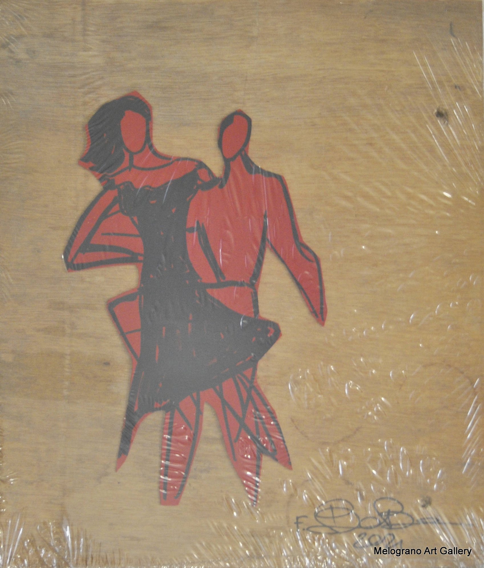 Opera di Futurboba con figurine rosse in materiale plastico su tavola coreana, sigillata sottovuoto, dedicata all’amore e alle relazioni