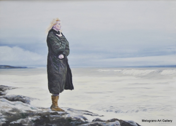 Donna solitaria che contempla il mare d’inverno, pittura realistica luminosa di Giovanni Graziani, atmosfera fredda e luce invernale sul mare.