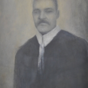 Ritratto a mezzo busto di un signore distinto con aria seria e baffi, opera di Davide Giallombardo